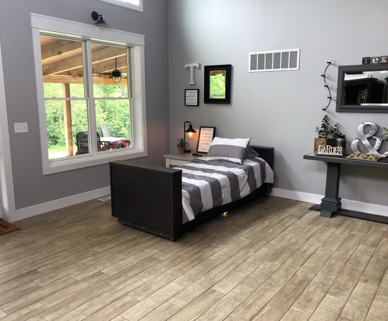 Image of the ActiveCare Deluxe Hospital Bed in a room.