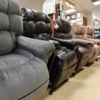 Lift chairs in various fabric and colors in a row.